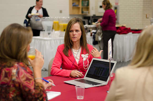 Online instructors gather for breakfast and instruction.