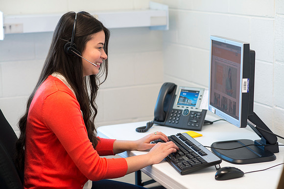 Students help take calls in the Pathway Support Center.