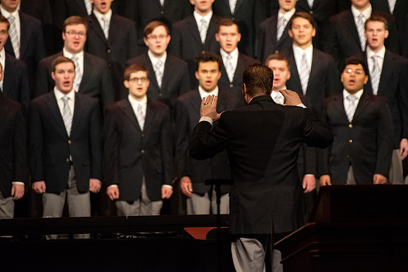 Mens choir perfroms at the devotional.