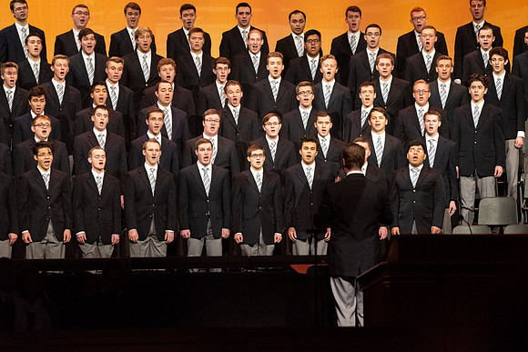 Mens choir perfroms at the devotional.