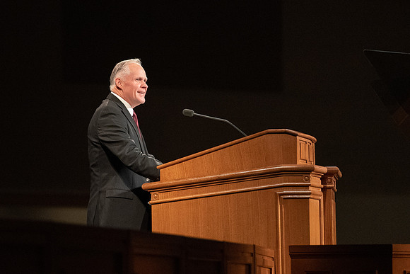 Humanities and Philosophy instructor Brian Merrill speaks at devotional in the BYU-Idaho Center.