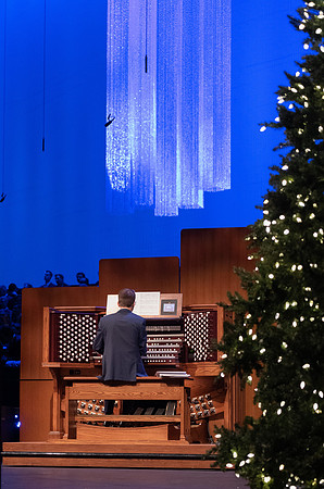 Organist playing for BYU-Idaho Men's Chorus singing musical number at devotional.