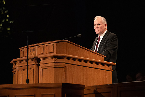 Humanities and Philosophy instructor Brian Merrill speaks at devotional in the BYU-Idaho Center.