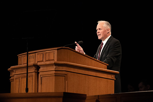 Humanities and Philosophy instructor Brian Merrill speaks at devotional in the BYU-Idaho Center.