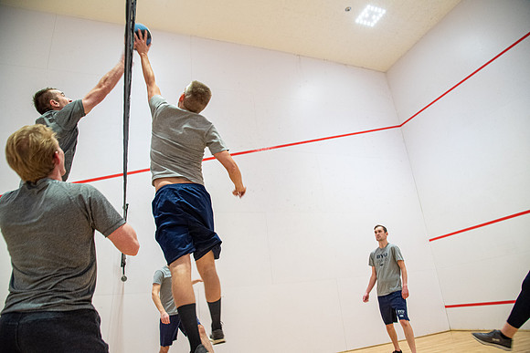 Group of students playing wallyball at BYU-Idaho raqetball courts in the Hart Auditorium building.