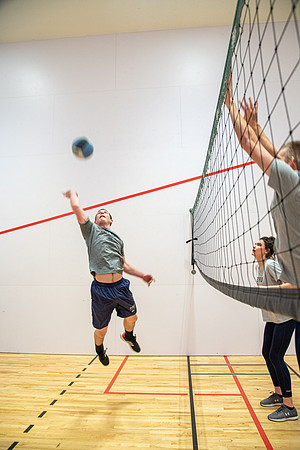 Group of students playing wallyball at BYU-Idaho raqetball courts in the Hart Auditorium building.