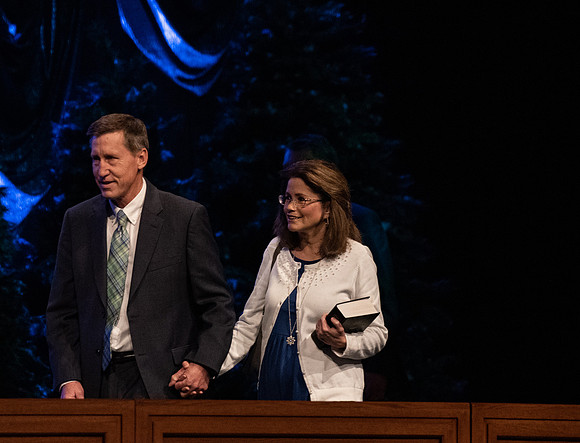 Brent Ashcraft enters the I-Center auditorium with his wife.