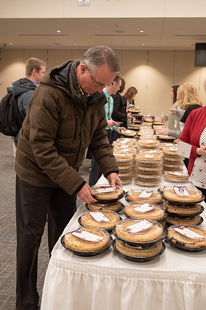 Employees come to get a pie from President Eyring and President's Executive Group.