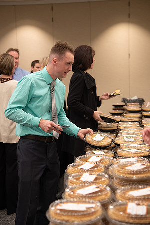 Employees come to get a pie from President Eyring and President's Executive Group.