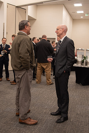 President Eyring socializing with an employee at the Employee Christmas Pie Social.