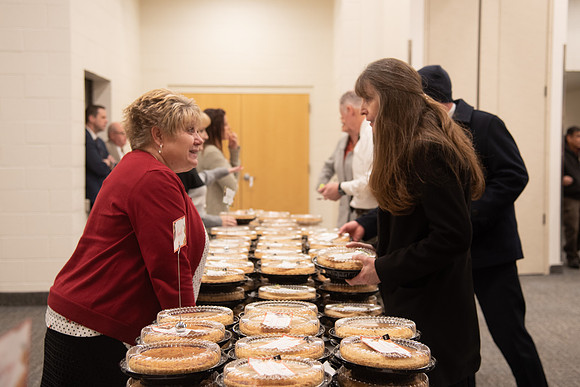 Employees come to get a pie from President Eyring and President's Executive Group.