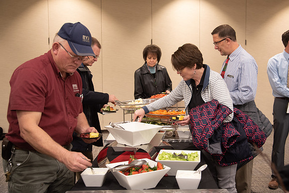 Employees come to get a pie and a snack from President Eyring and President's Executive Group.