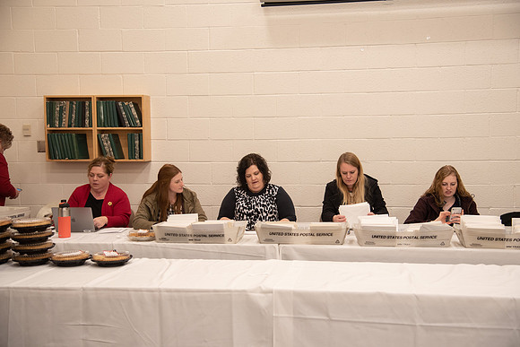 Employees come to get a pie from President Eyring and President's Executive Group.