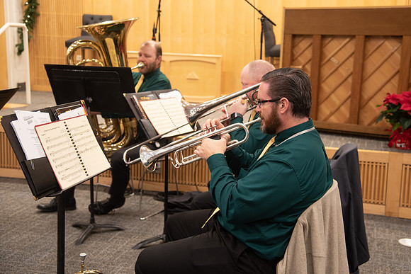 Entertainment at the Employee Christmas Pie Social. Brass band playing Christmas songs.