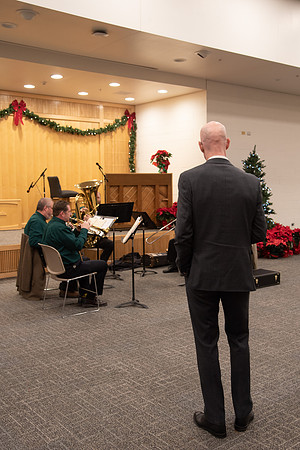 President Eyring listening to the brass band play Christmas music.