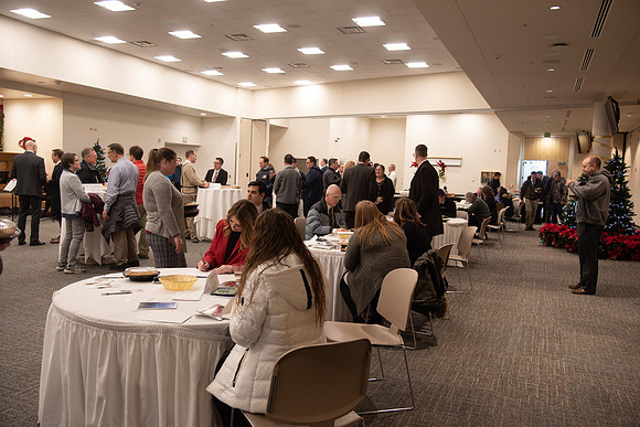Employees gather to write cards to others and get a pie from President Eyring and President's Executive Group.