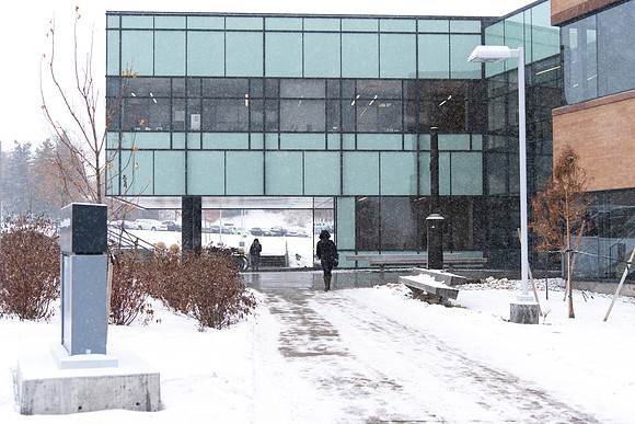Fresh snow falling on campus of BYU-Idaho. Science and Technology Building