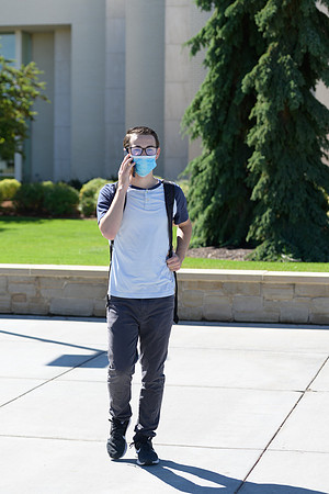 Student volunteers show the way to stay safe during this COVID 19 pandemic by social distancing, following pathway arrows and proper wearing of masks .