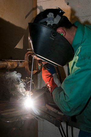 Student welds during class time.