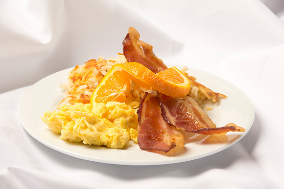 Scrambled eggs, choice of meat: Sausage Patties, Link Sausage, Bacon or Ham. Served with Hash Browns and Baker's Choice of Pastry.