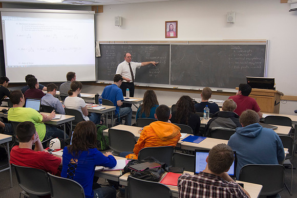 Brother Johanson answers a student's question during his Math 109 Precalculus class during the 2014 Spring Semester.