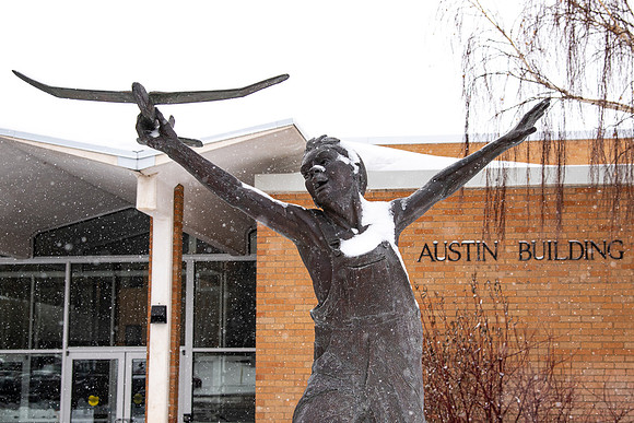 Boy in Flight in front of the Mark Austin Building.