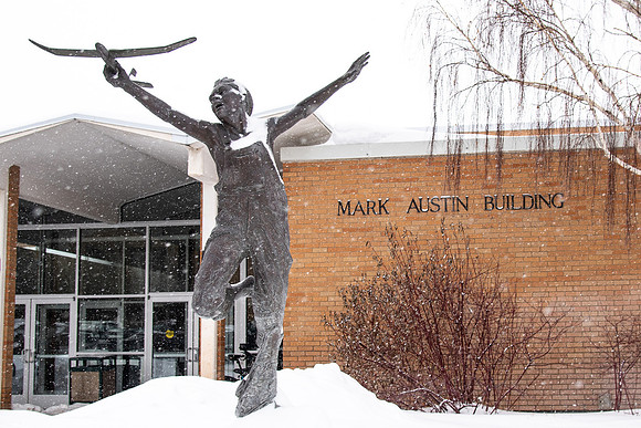 Boy in Flight in front of the Mark Austin Building.