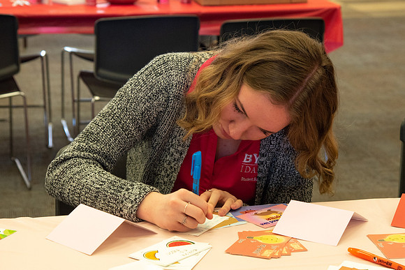 Students decorate sugar cookies and valentine cards in the MC on Valentine's Day.