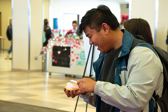 Students decorate sugar cookies and valentine cards in the MC on Valentine's Day.