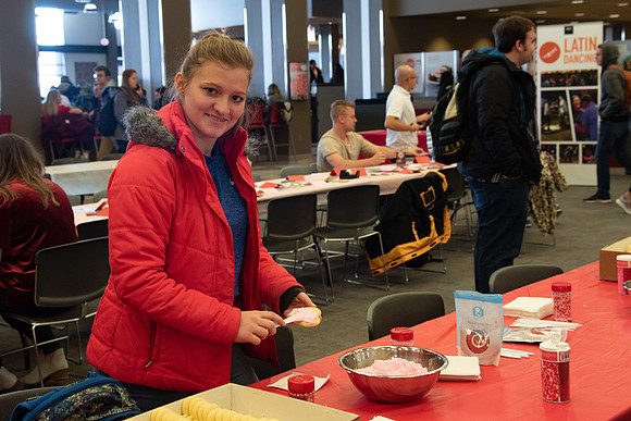 Students decorate sugar cookies and valentine cards in the MC on Valentine's Day.