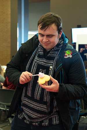 Students decorate sugar cookies and valentine cards in the MC on Valentine's Day.