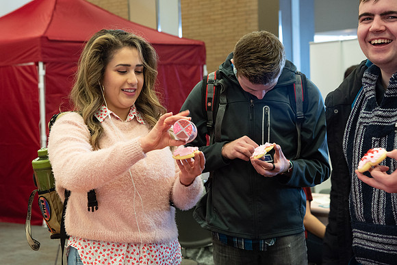 Students decorate sugar cookies and valentine cards in the MC on Valentine's Day.