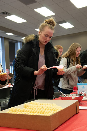 Students decorate sugar cookies and valentine cards in the MC on Valentine's Day.