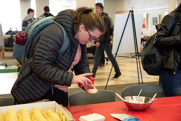 Students decorate sugar cookies and valentine cards in the MC on Valentine's Day.