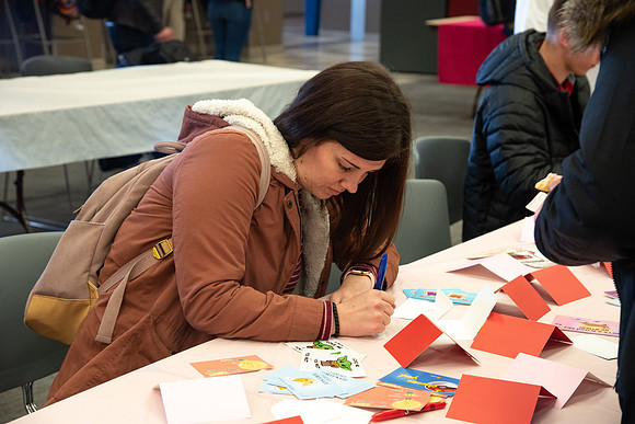 Students decorate sugar cookies and valentine cards in the MC on Valentine's Day.