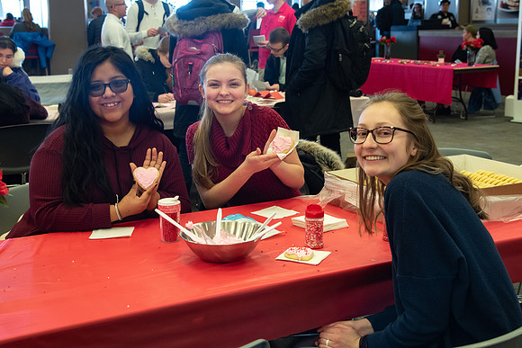 Students decorate sugar cookies and valentine cards in the MC on Valentine's Day.