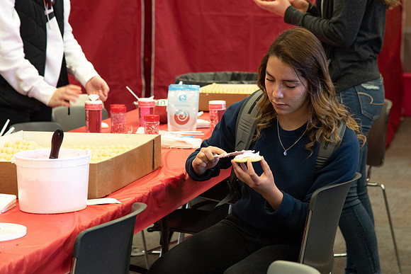Students decorate sugar cookies and valentine cards in the MC on Valentine's Day.