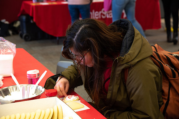 Students decorate sugar cookies and valentine cards in the MC on Valentine's Day.