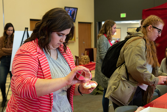 Students decorate sugar cookies and valentine cards in the MC on Valentine's Day.