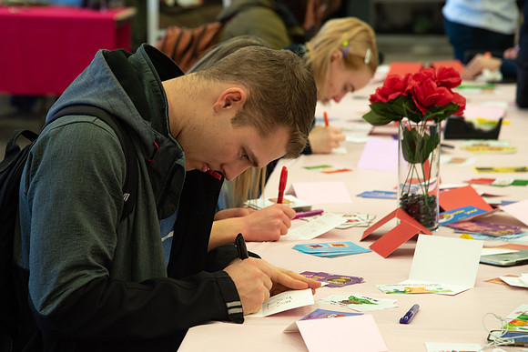 Students decorate sugar cookies and valentine cards in the MC on Valentine's Day.