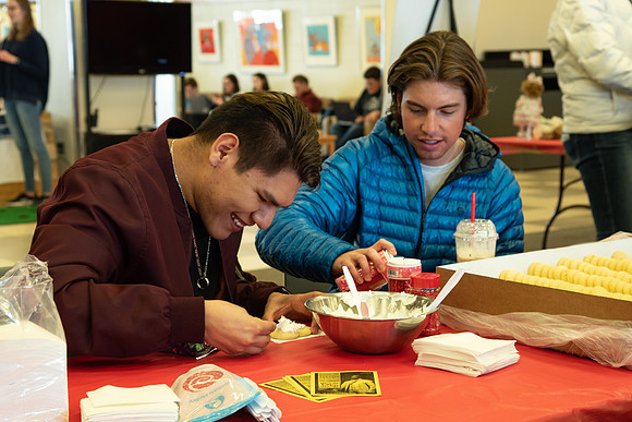 Students decorate sugar cookies and valentine cards in the MC on Valentine's Day.
