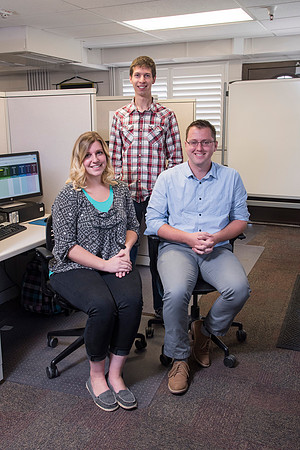Employees work on developing a better curriculum for online students.