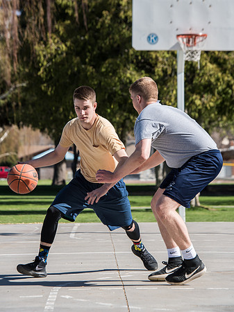 Jacob and Jacob, two BYU-Idaho students, play one on one basketball at the Smith Park court.