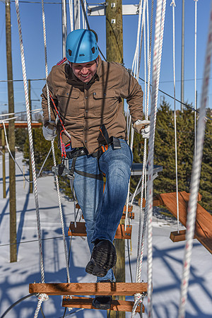 Students explore the new ropes course which includes multiple suspended obstacles as well as a ziplines course.
