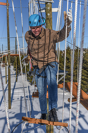 Students explore the new ropes course which includes multiple suspended obstacles as well as a ziplines course.