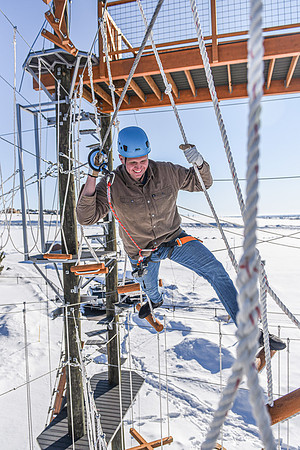 Students explore the new ropes course which includes multiple suspended obstacles as well as a ziplines course.
