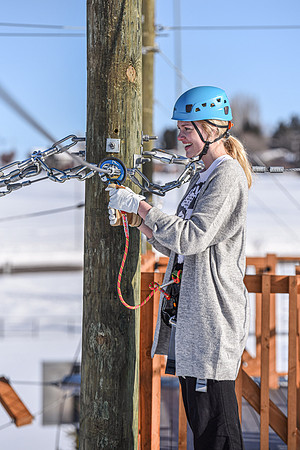 Students explore the new ropes course which includes multiple suspended obstacles as well as a ziplines course.