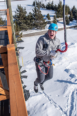 Students explore the new ropes course which includes multiple suspended obstacles as well as a ziplines course.