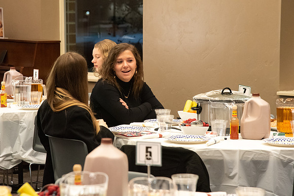 Faculty and staff of Housing and Student Living gather for an early morning breakfast and inspiration.