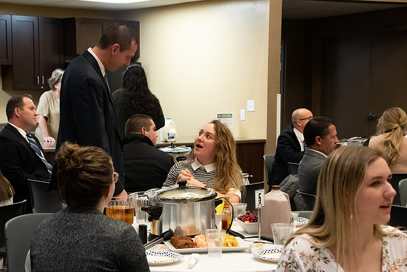 Faculty and staff of Housing and Student Living gather for an early morning breakfast and inspiration.